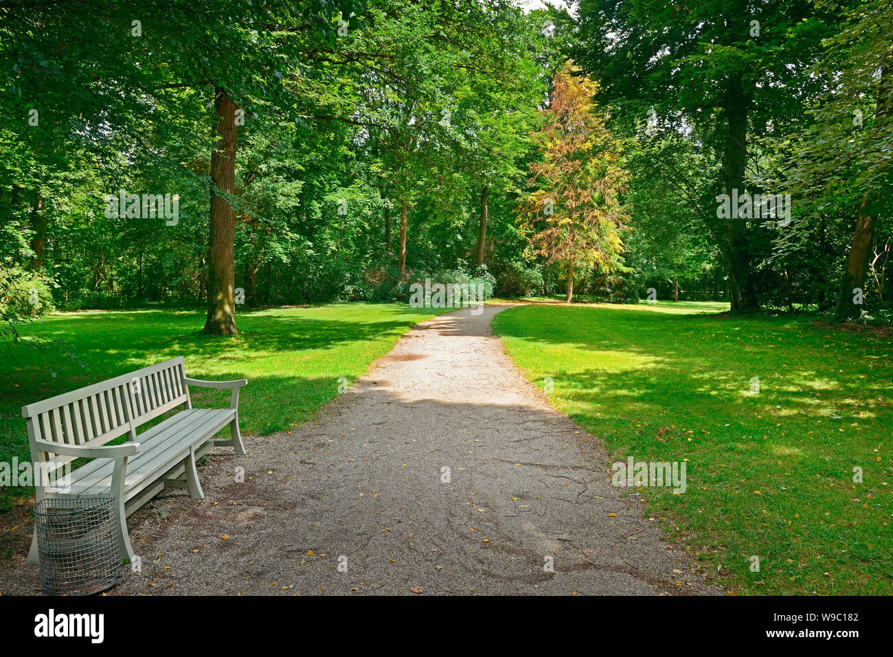 Bench in a beautiful park Stock Photo - Alamy