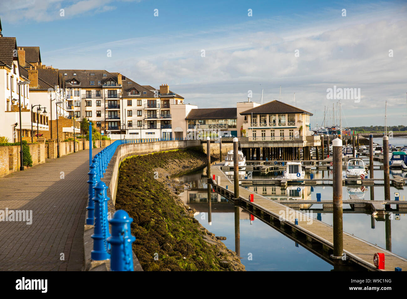 Ireland, Leinster, Fingal, Co Dublin, Malahide, seafront path beside Marina village waterfront housing development Stock Photo