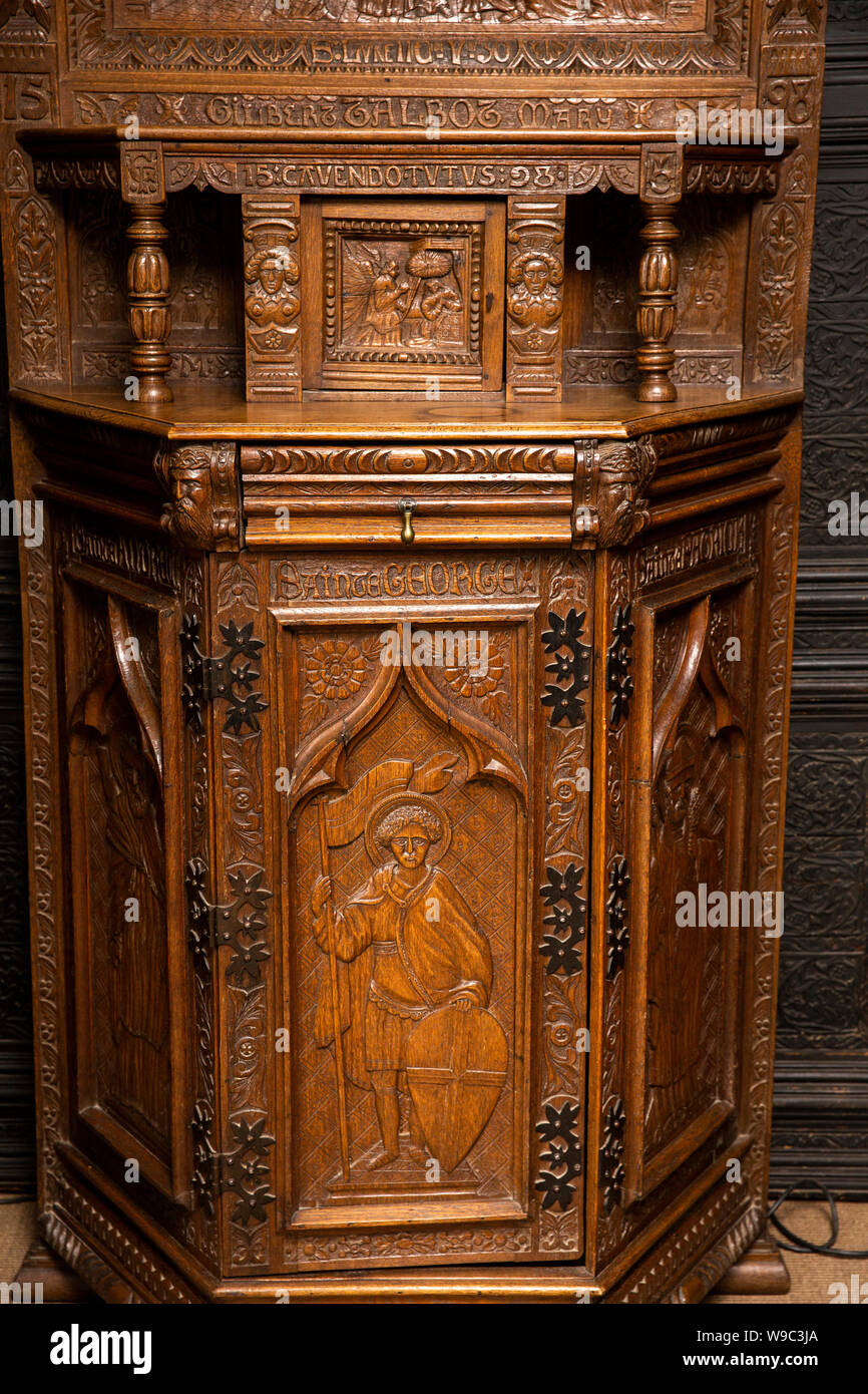 Ireland, Leinster, Fingal, Co Dublin, Malahide Castle, interior, Oak Room, ornately carved 1598 Talbot family cabinet with St George decoration Stock Photo