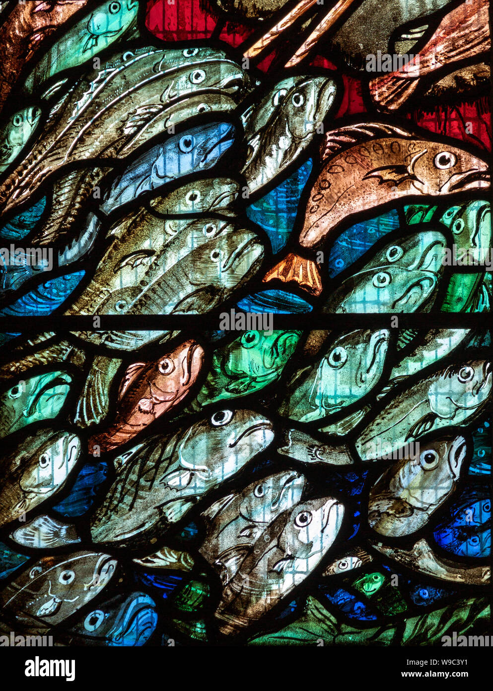Detail of fish in stained glass window by William Nicholson, Mells