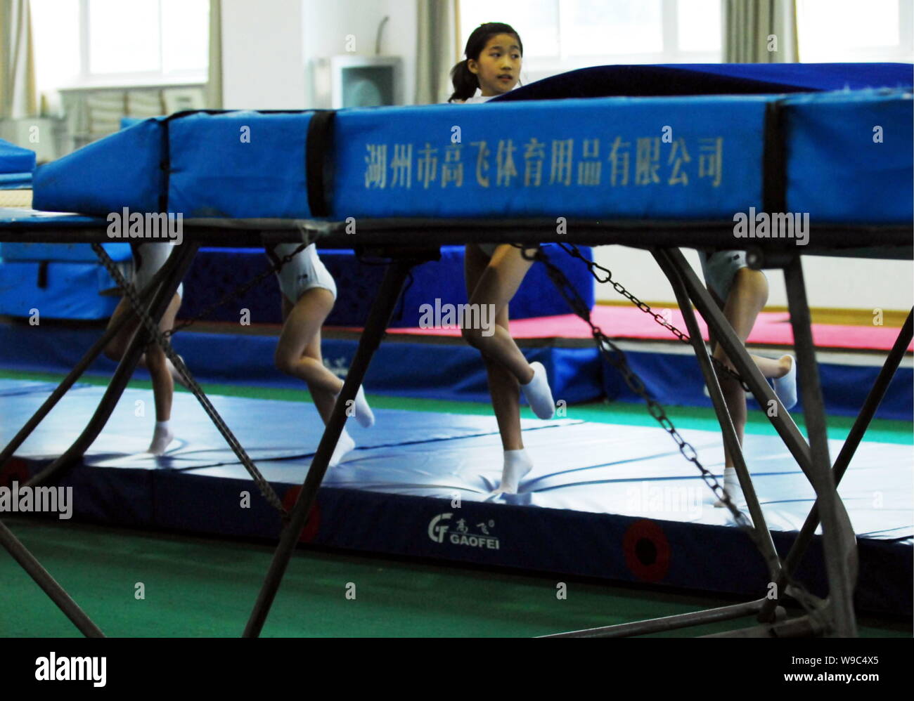 Little Chinese trampoline athletes exercise during a training session at the Fuzhou Training Base for the National Trampoline Assembly Training Team Stock Photo - Alamy