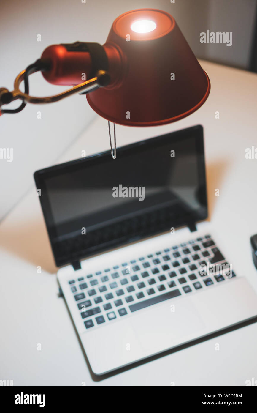 Personal computer standing on the table at late evening. Stock Photo