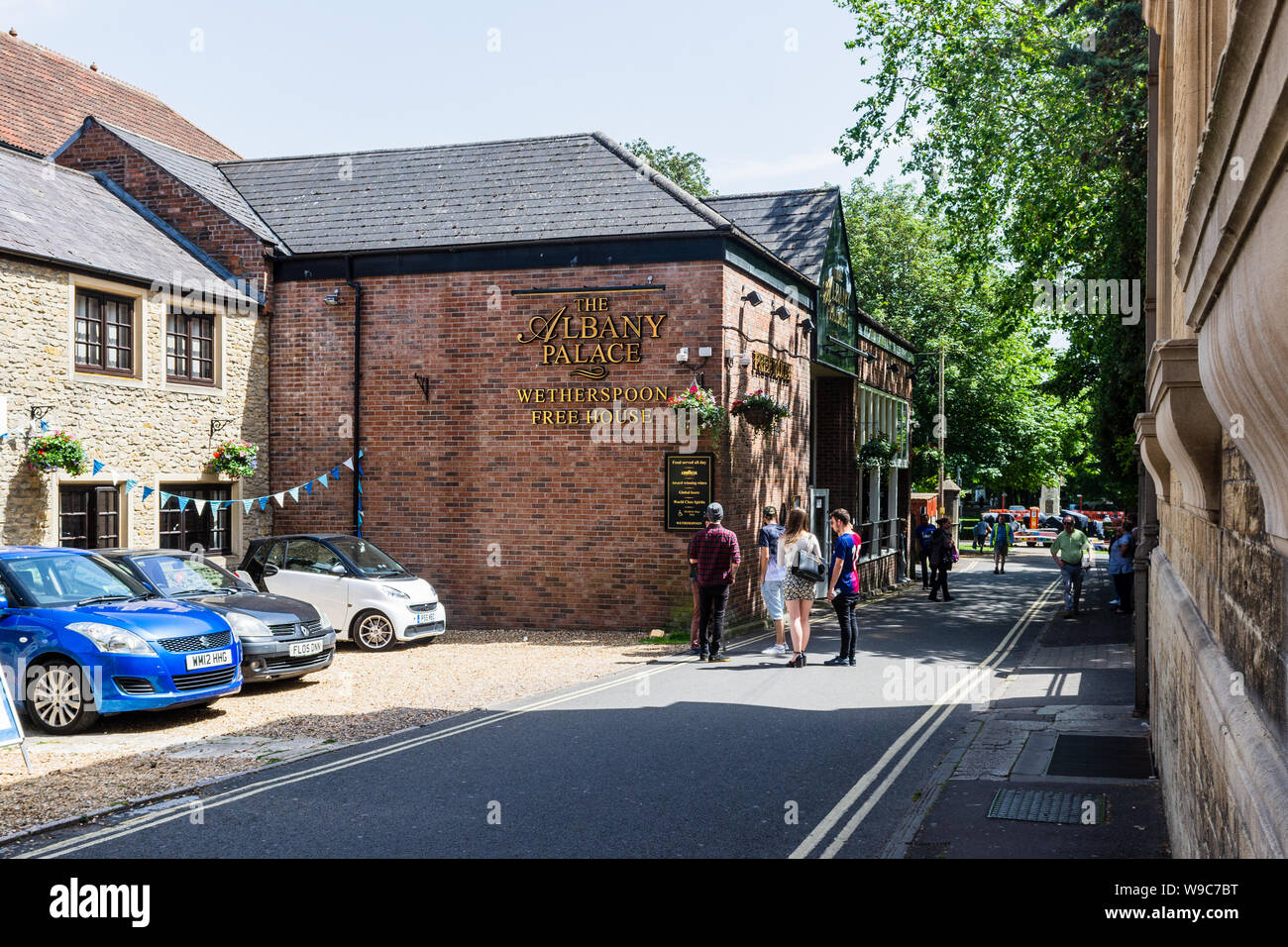 The pub The Albany Palace, part of the Wetherspoons chain, seen from the side on a sunny afternoon in Trowbridge Wiltshire Stock Photo
