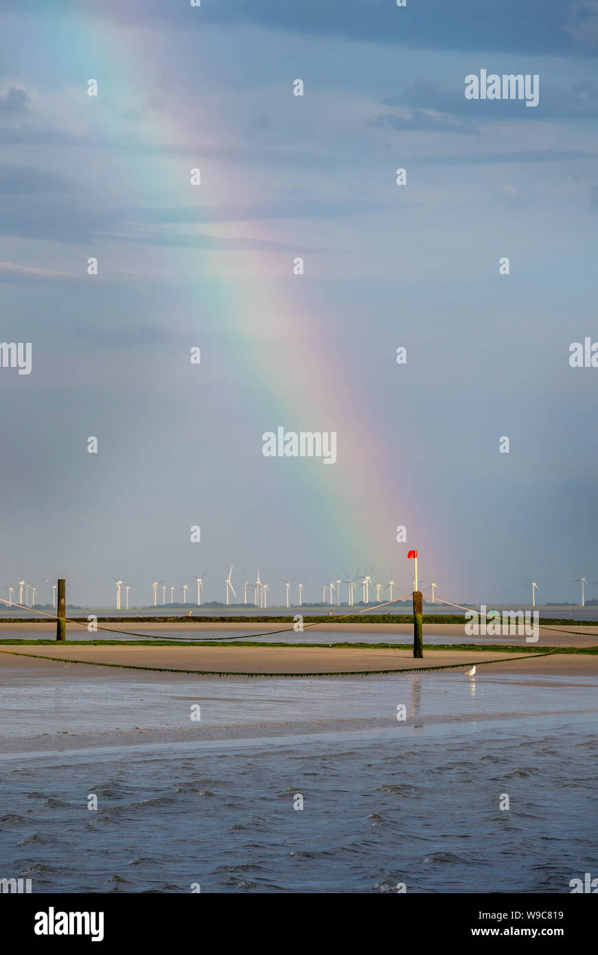 Rainbow over Norderney beach, travel  Germany Stock Photo