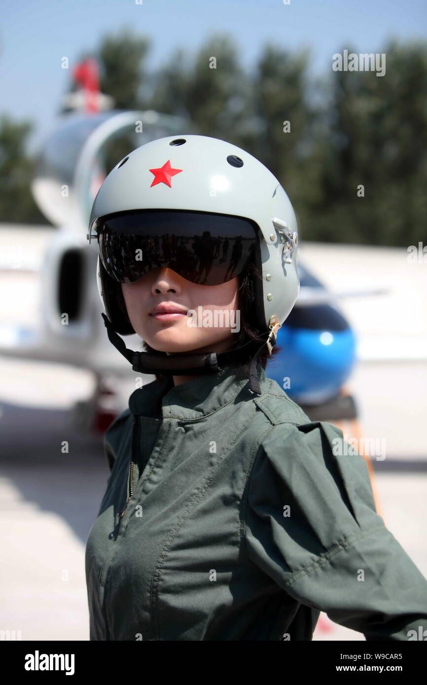 A young female fighter plane pilot of Chinese PLA Air Force walks past a  training plane after a new flight suits delivery ceremony at an airport in  Ta Stock Photo - Alamy