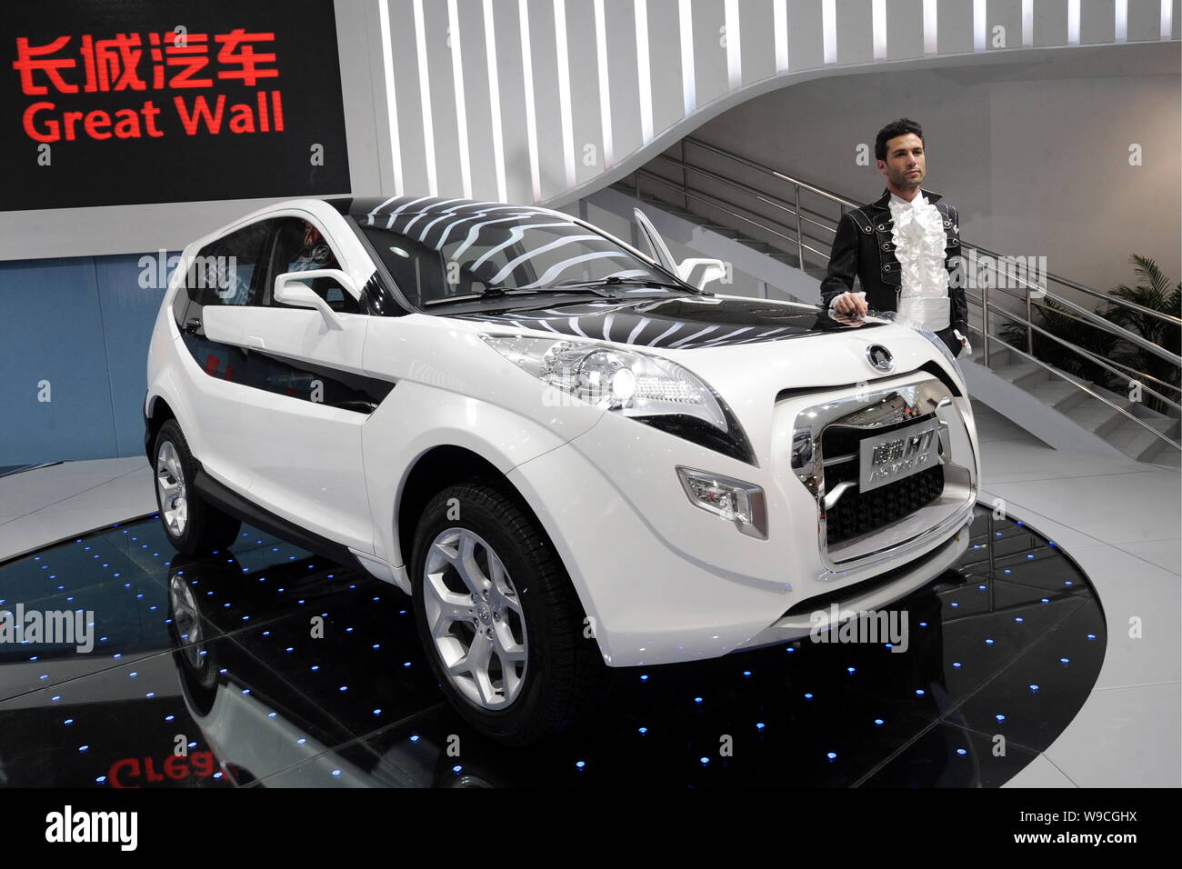 A model poses with a Great Wall Hover H7 at the 13th Shanghai International Automobile Industry Exhibition, known as Auto Shanghai 2009, in Shanghai, Stock Photo