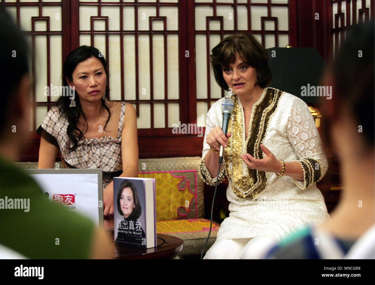 Cherie Blair, right, wife of former British Prime Minister Tony Blair, speaks next to Wendi Deng Murdoch, wife of News Corp. Chairman and CEO Rupert M Stock Photo