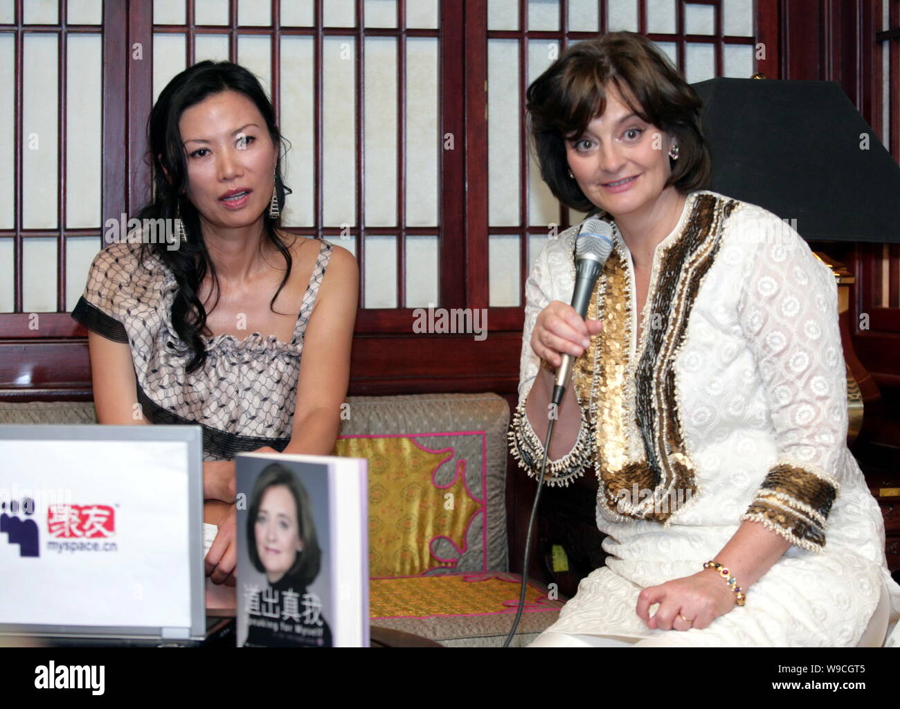 Cherie Blair, right, wife of former British Prime Minister Tony Blair, speaks next to Wendi Deng Murdoch, wife of News Corp. Chairman and CEO Rupert M Stock Photo