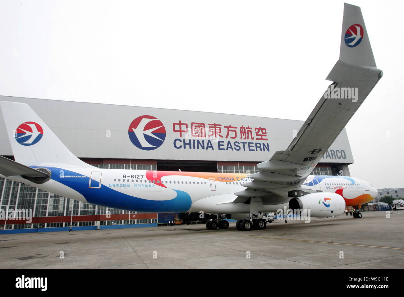 An Airbus 330-300 of China Eastern Airlines, painted with patterns of the 2010 Shanghai World Expo, is seen at the Hongqiao International Airport in S Stock Photo