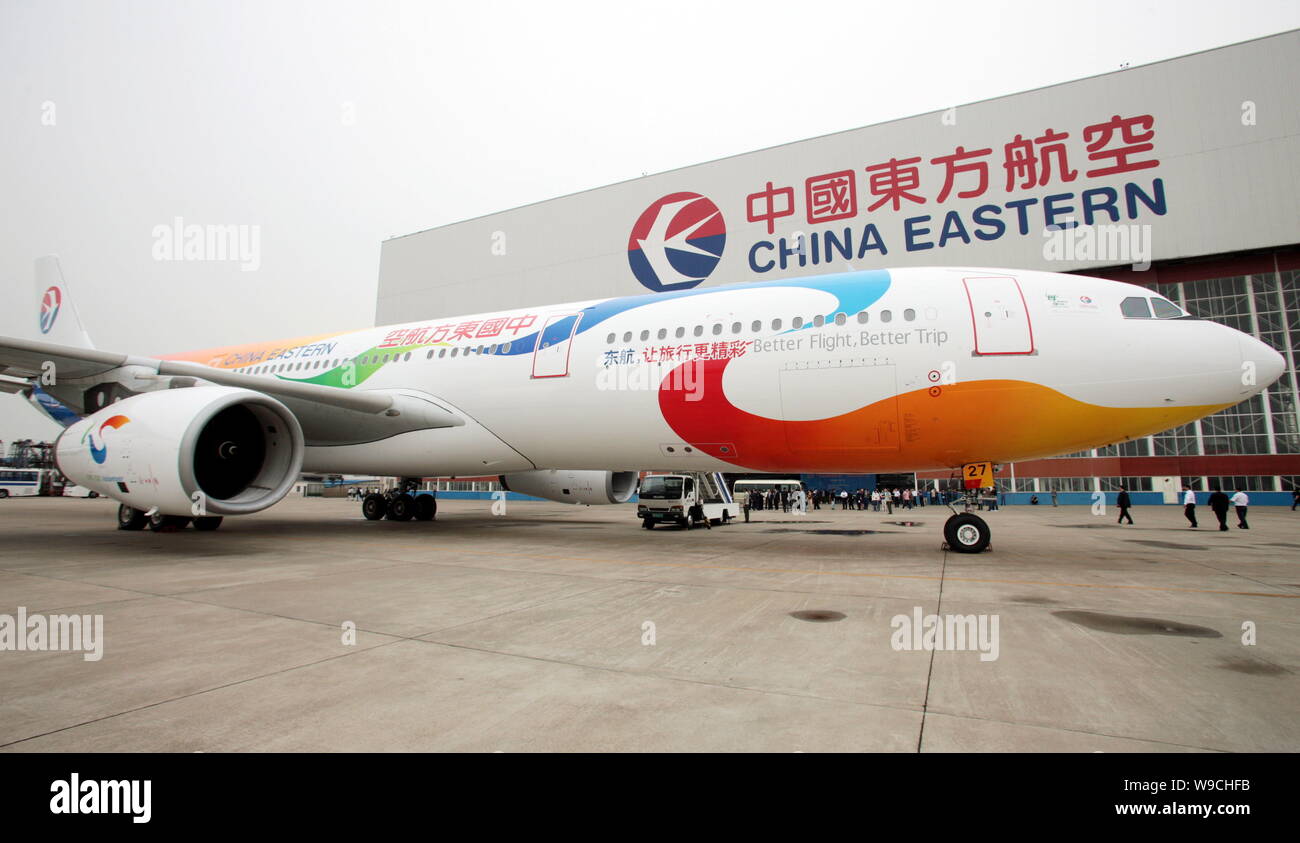 An Airbus 330-300 of China Eastern Airlines, painted with patterns of the 2010 Shanghai World Expo, is seen at the Hongqiao International Airport in S Stock Photo