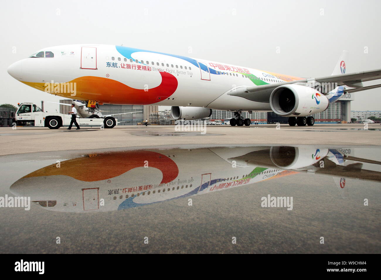 An Airbus 330-300 of China Eastern Airlines, painted with patterns of the 2010 Shanghai World Expo, is seen at the Hongqiao International Airport in S Stock Photo