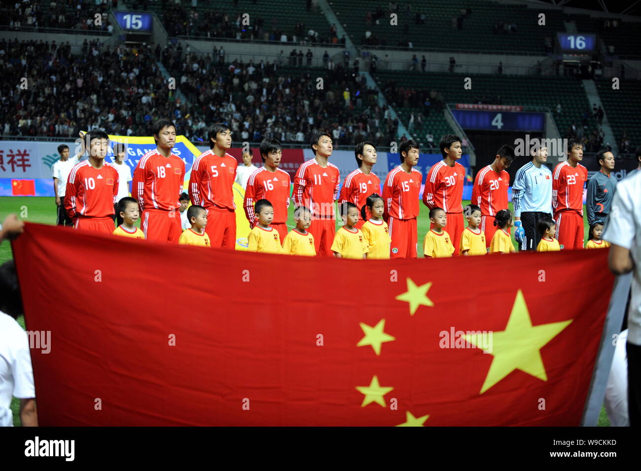 Members of the first squad of Chinese national men soccer team pose before competing against Senegal at a friendly soccer match in Harbin city, northe Stock Photo