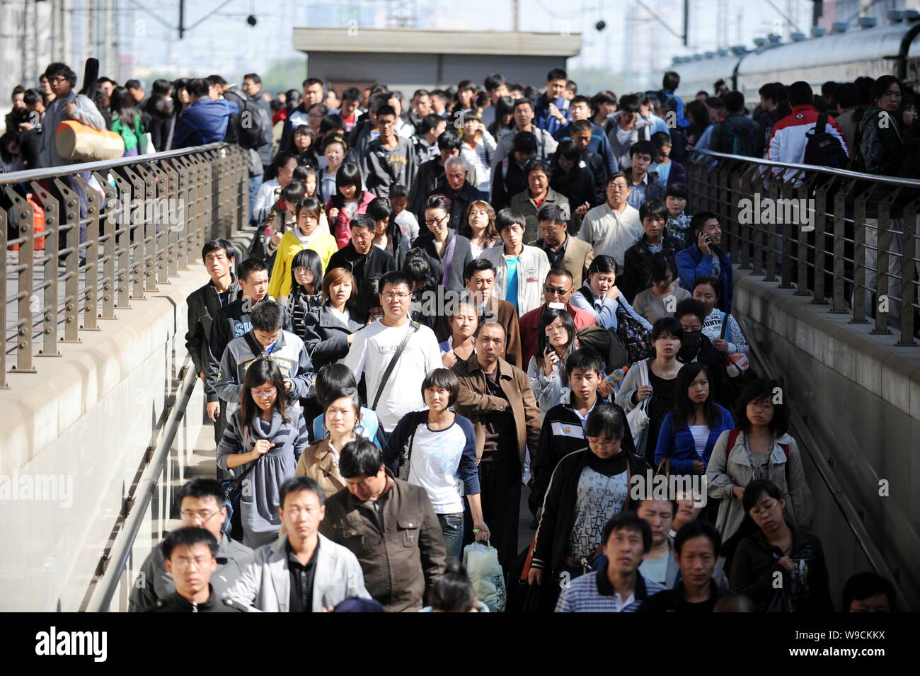 Crowds of Chinese passengers are seen at the Shenyang North Railway Station during the post-National Day rush in Shenyang city, northeast Chinas Liaon Stock Photo
