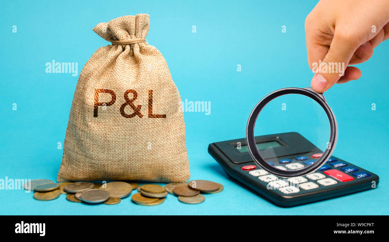 Money bag with the word Profit & loss and calculator. Business analytics and report. Company financial performance. Cash flow generation. Profit, inco Stock Photo