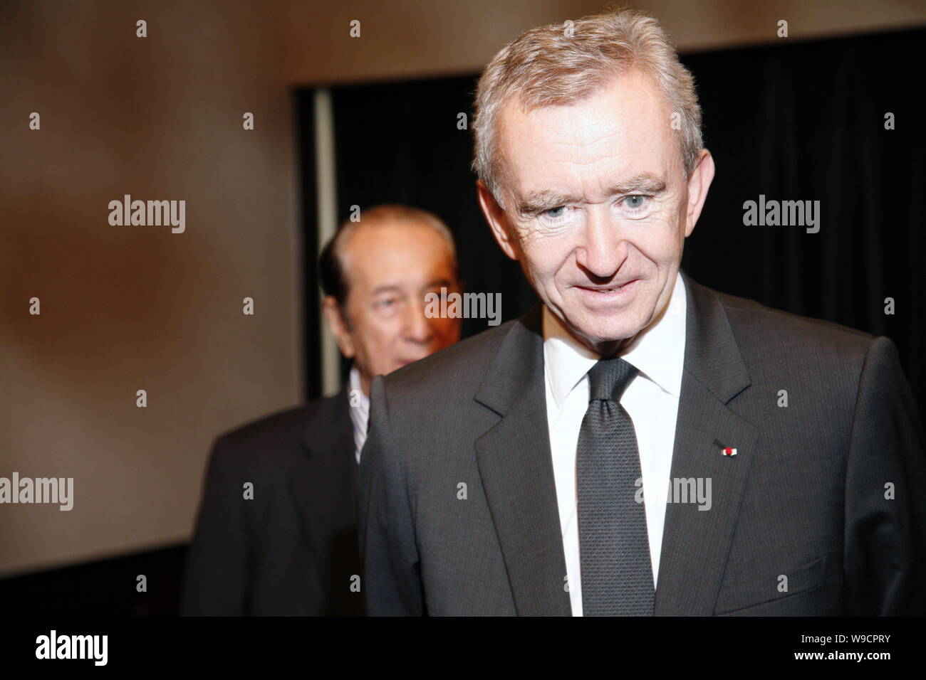 Bernard Arnault (F), CEO of Moet Hennessy Louis Vuitton (MHLV) and Casino  tycoon Stanley Ho are seen at the ground-breaking ceremony for LAvenue  Shang Stock Photo - Alamy