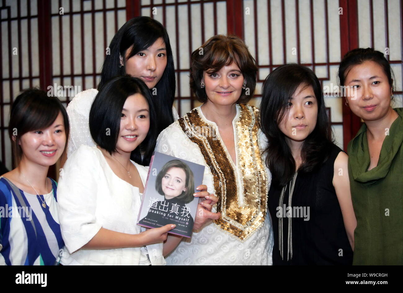 Cherie Blair, third right, wife of former British Prime Minister Tony Blair, poses with Chinese netizens during an event to promote the Chinese versio Stock Photo