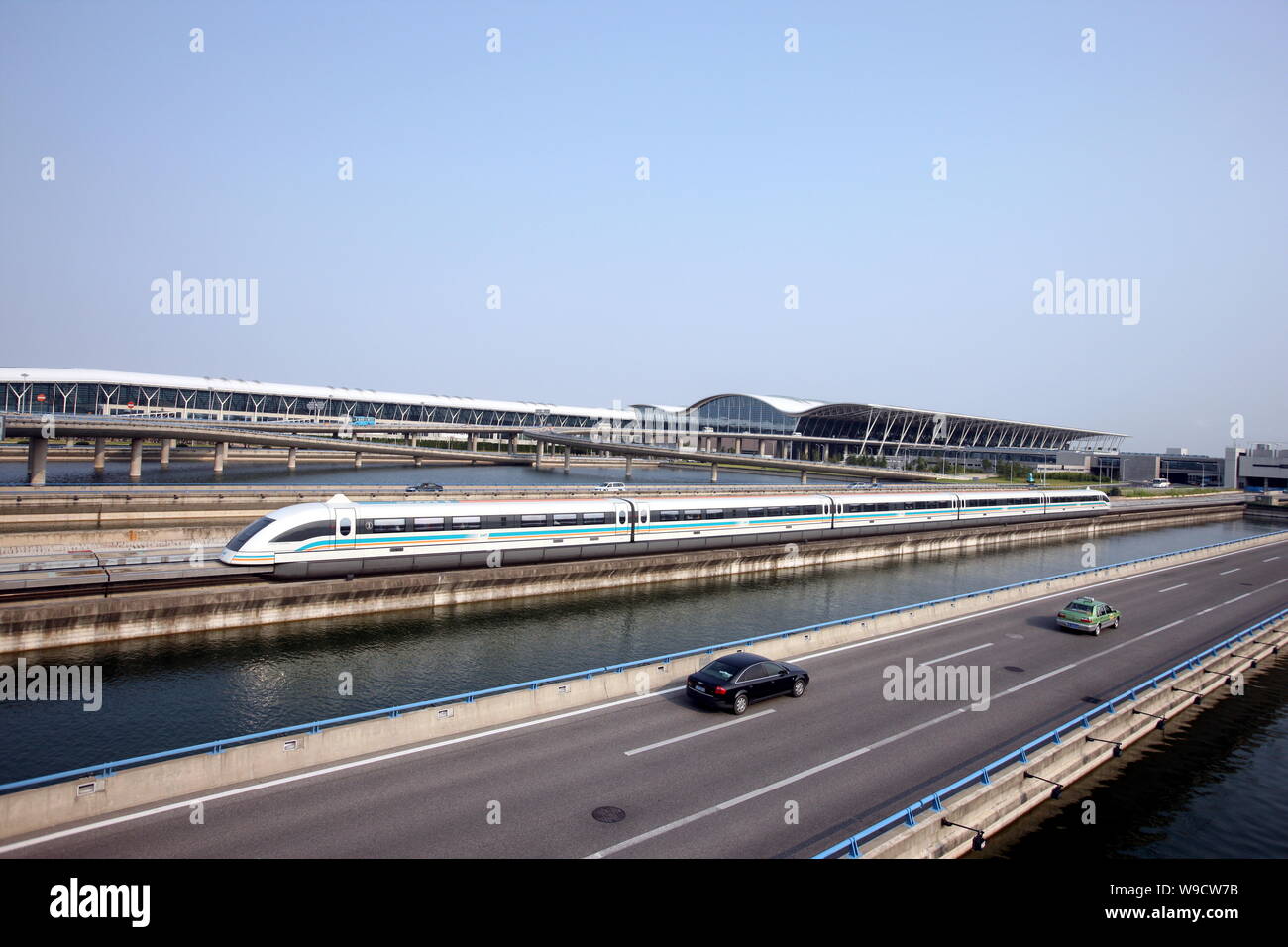 --FILE--A maglev train drives past the Shanghai Pudong International ...