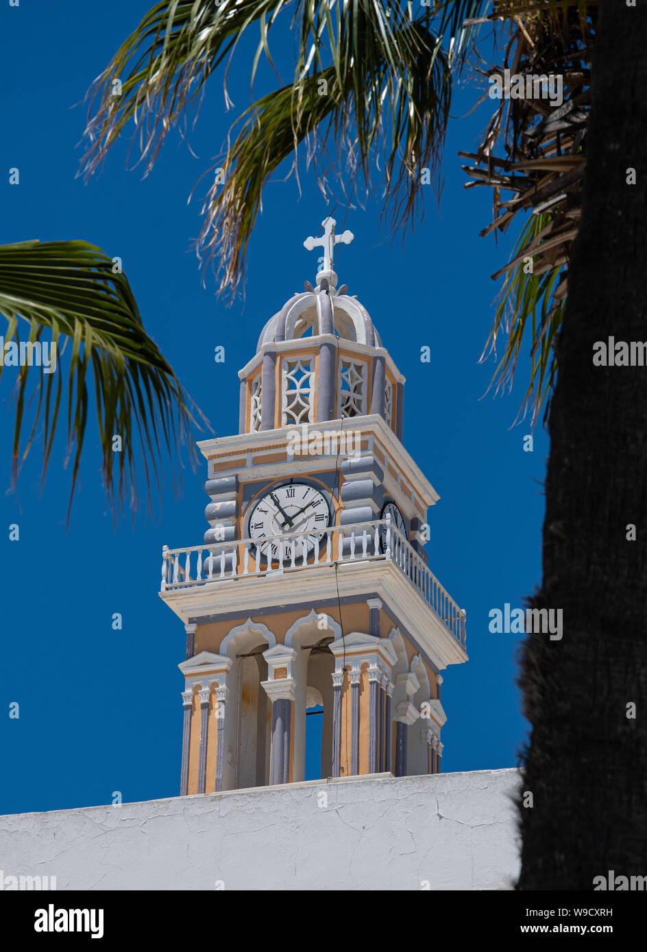 The Clock tower of St John the Baptist Cathoilc Cathedral in Fira Stock ...