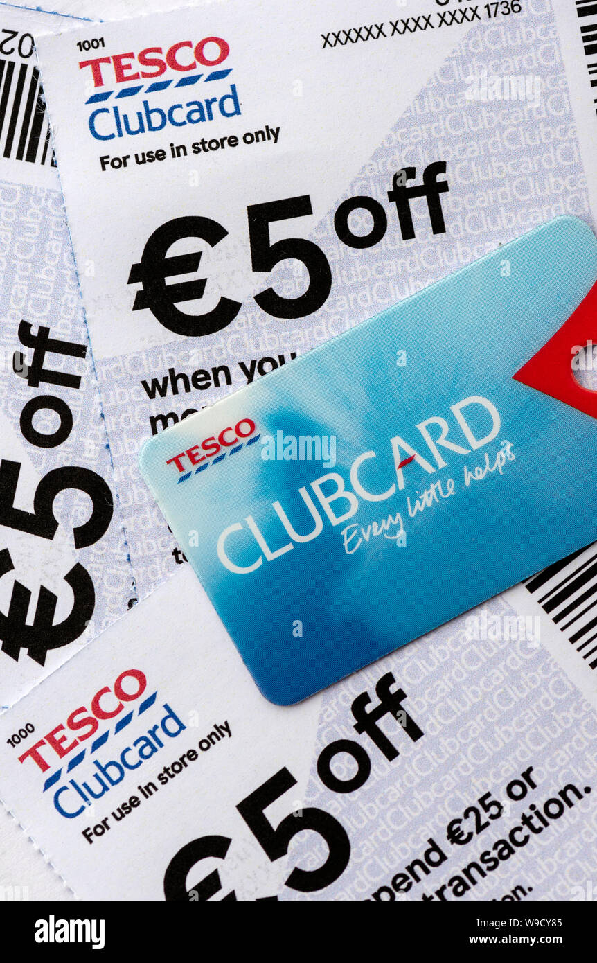 Tesco Ireland '5 Euro off' discount coupon vouchers and loyalty clubcard or club card from above. Smart loyalty scheme shopping experience. Stock Photo