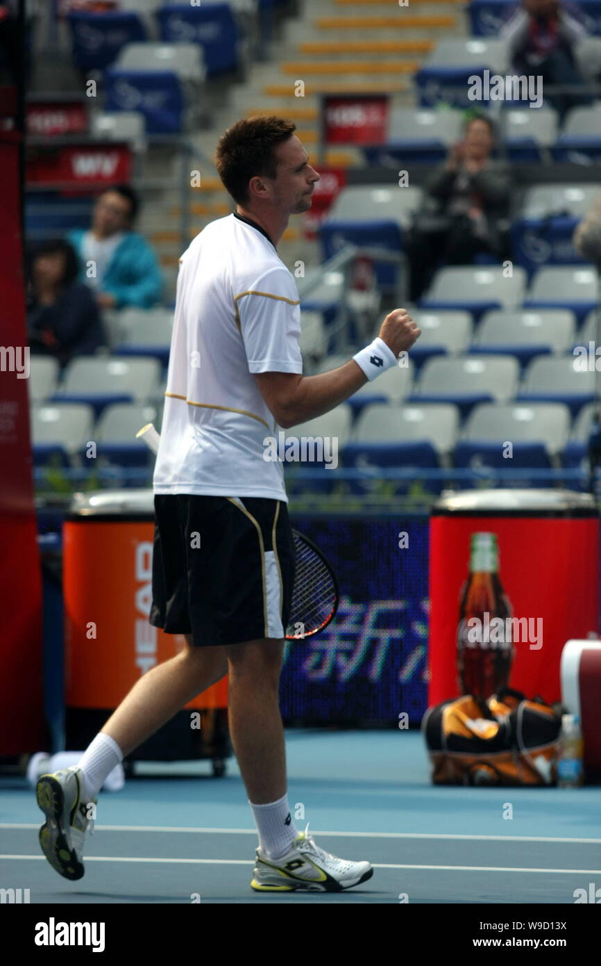 Robin Soderling of Sweden reacts while competing against Novak Djokovic of Serbia during the semifinal of the mens singles of the China Open 2009 in B Stock Photo