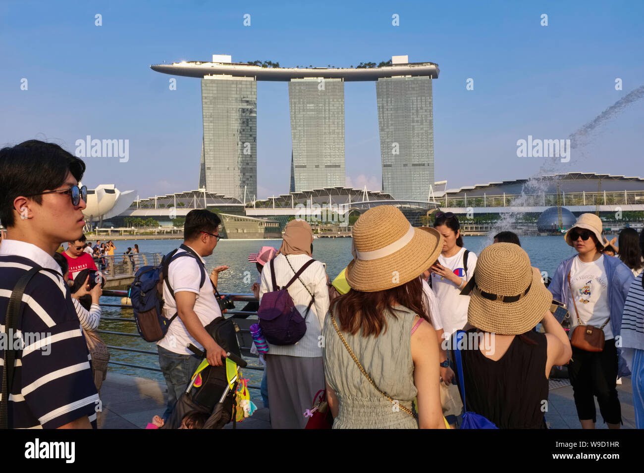 Chinese tourists on pedestrian Jubilee Bridge posing for photographs ...