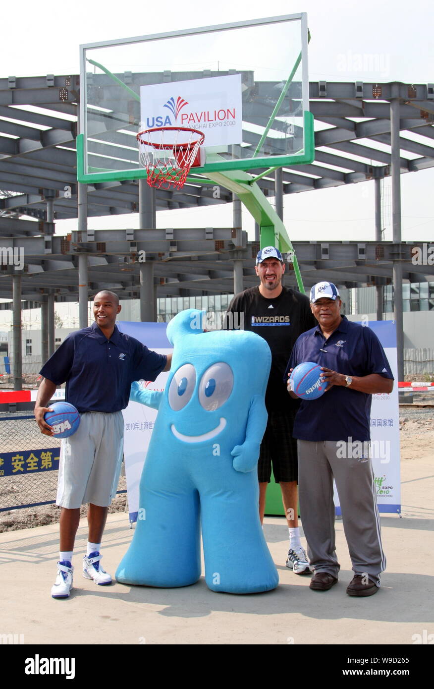 (From left) NBA player Caron Butler of the Washington Wizards, former Bullets player Gheorghe Muresan and NBA Hall of Fame center Wes Unseld pose with Stock Photo