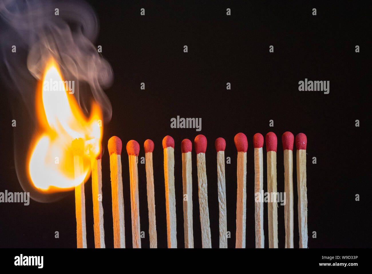 Photo of burning matchstick. Risk management concept Stock Photo - Alamy