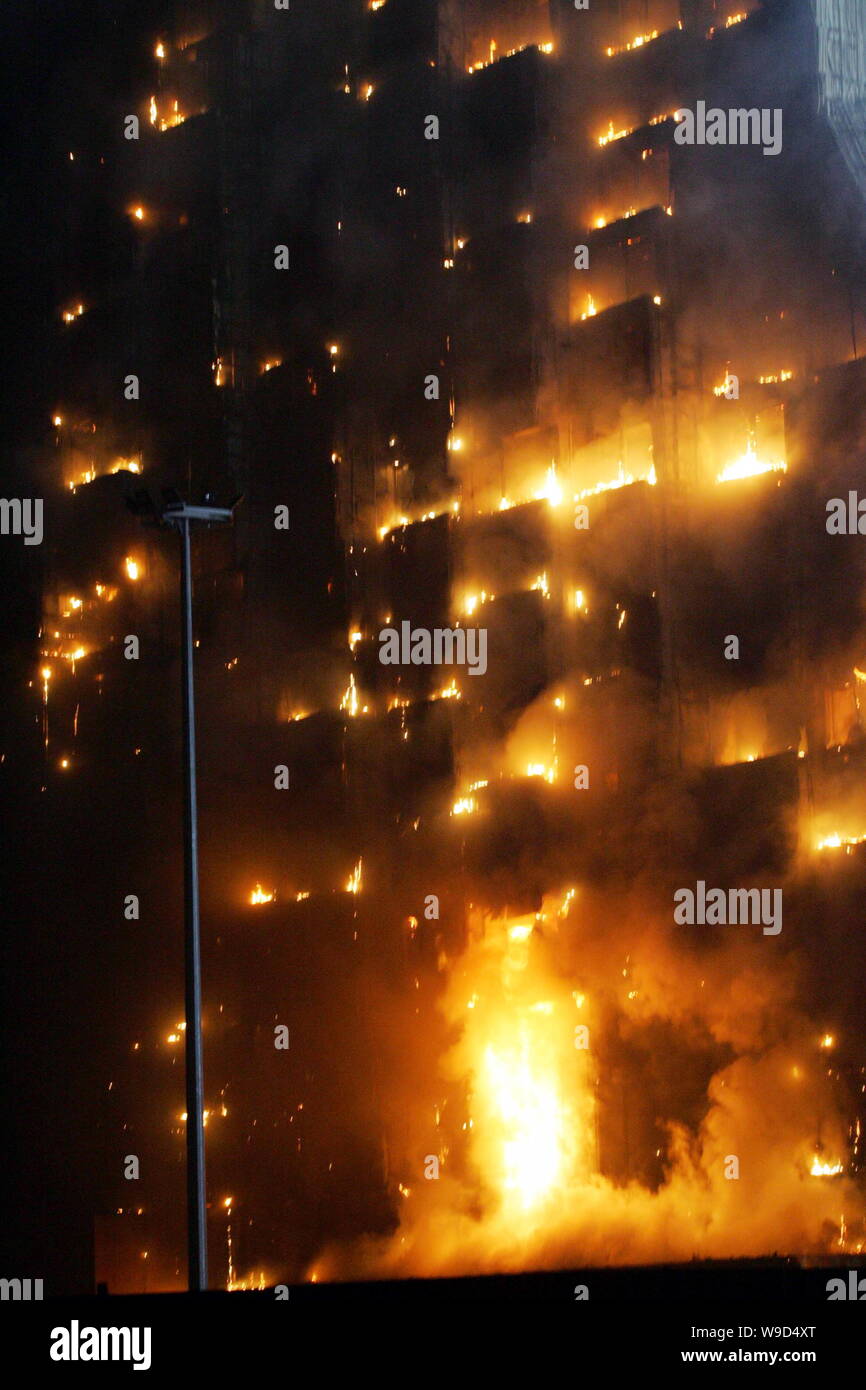 The Mandarin Oriental Hotel building is seen on fire near the new CCTV Tower during the Lantern Festival in Beijing, China, Monday, 9 February 2009. Stock Photo