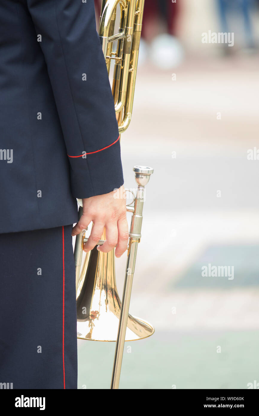 A wind instrument parade - a man holding a trumpet Stock Photo