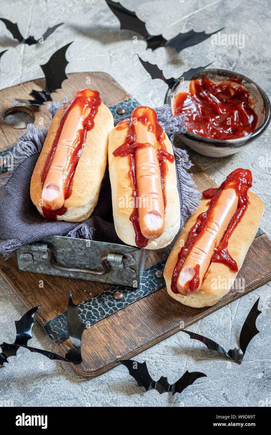 Creepy Halloween hot dogs look like a bloody fingers Stock Photo Alamy