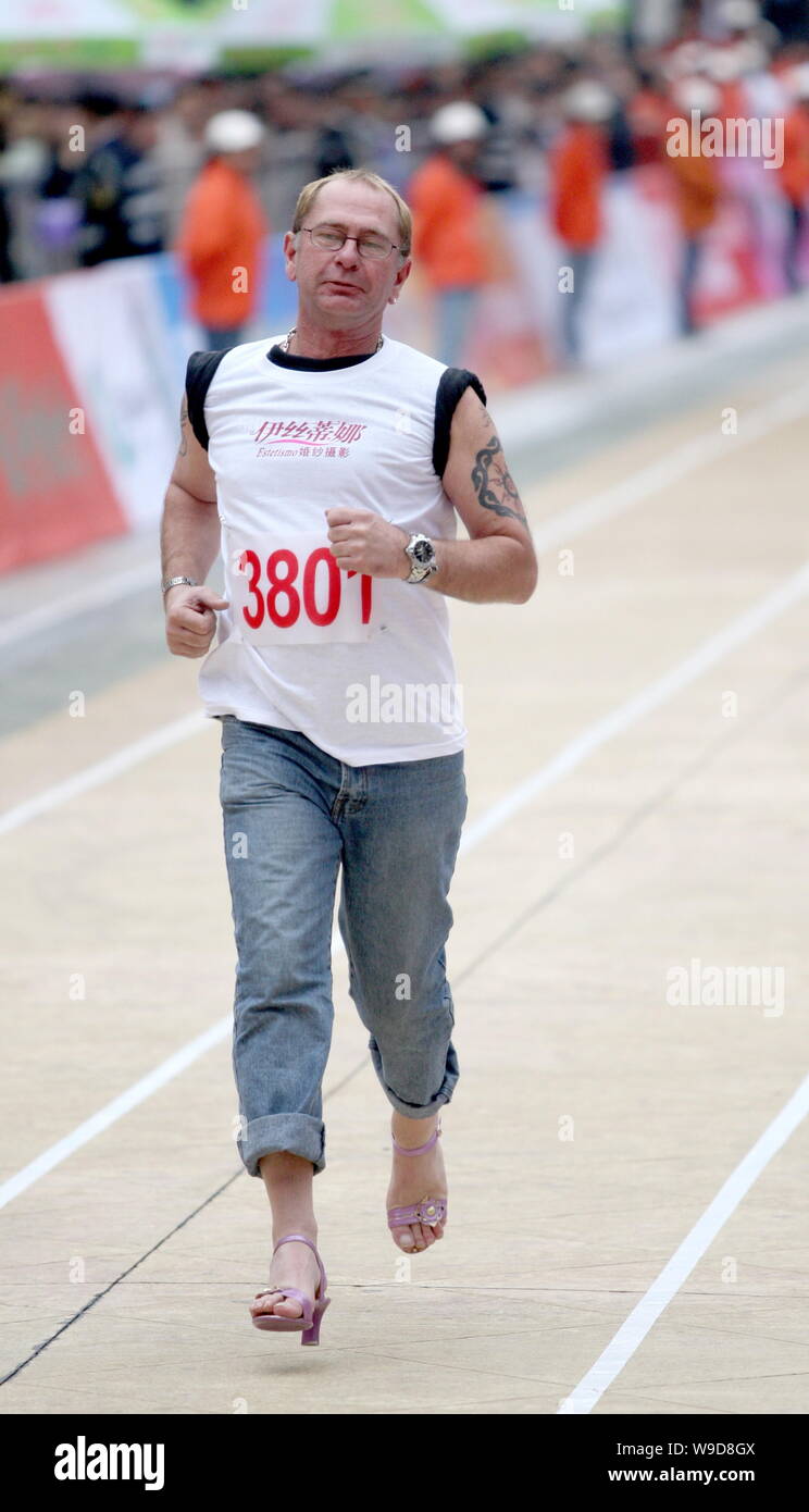 A foreign participant wearing highheel shoes competes during the mens