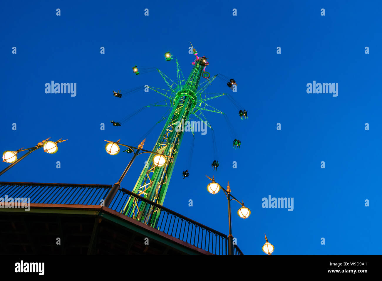 The swing ride or chair swing ride in the Tivoli amusement park at night at Copenhagen Denmark Stock Photo