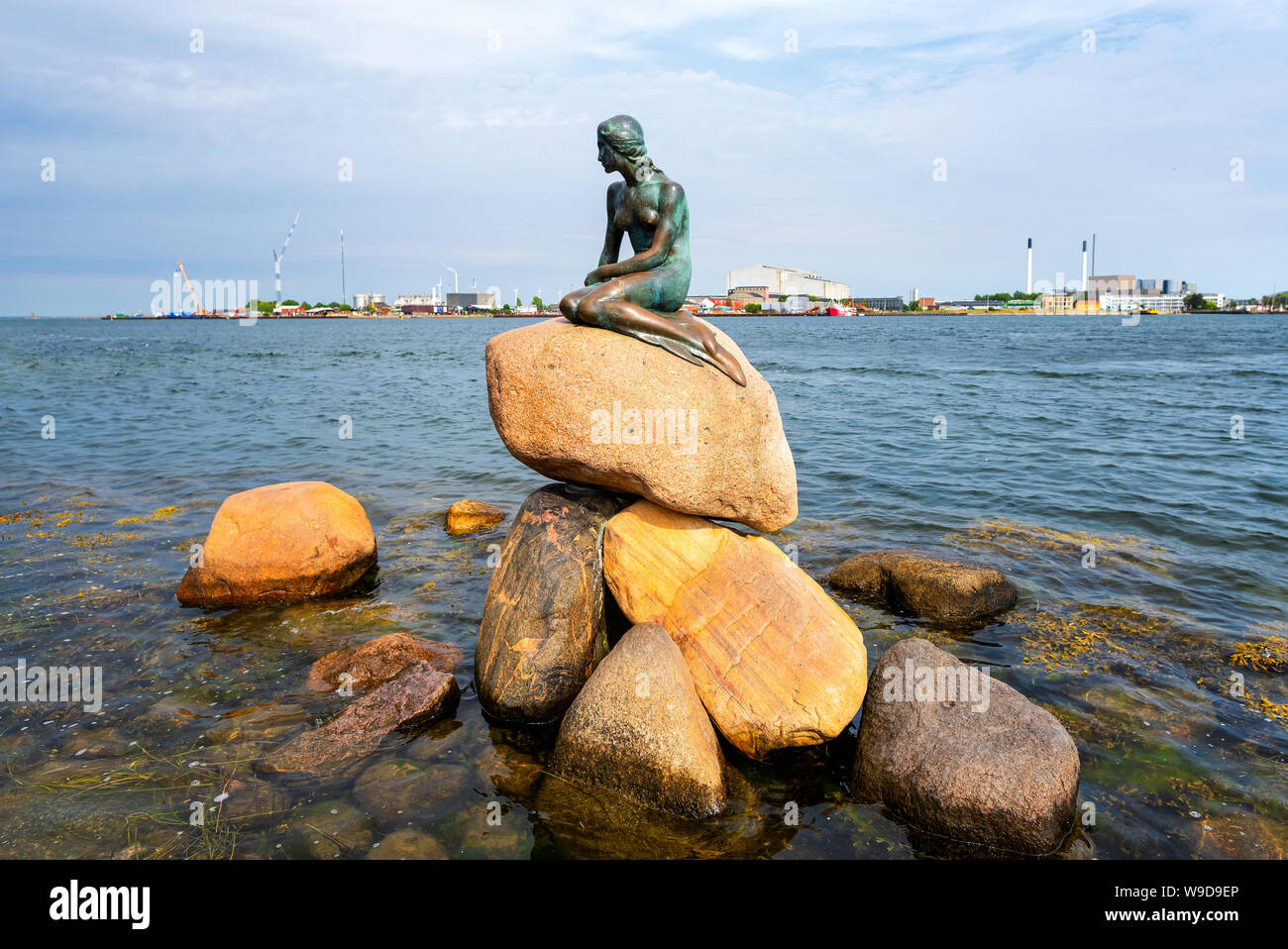 Statue of The Little Mermaid at Langelinie in Copenhagen, Denmark.The sculpture is displayed on a rock by the waterside at the Langelinie promenade in Stock Photo