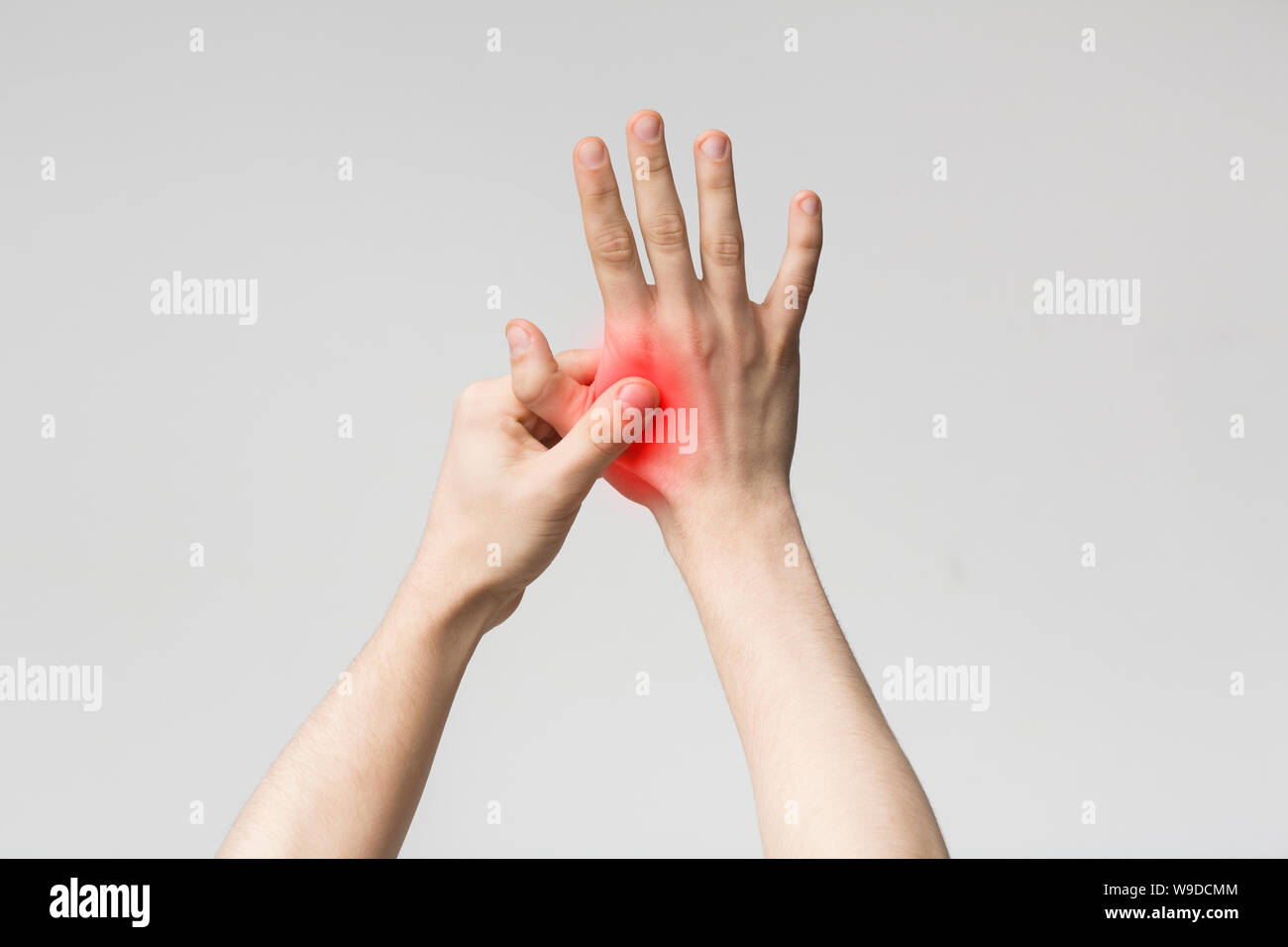 Young man suffering from pain in palm Stock Photo Alamy