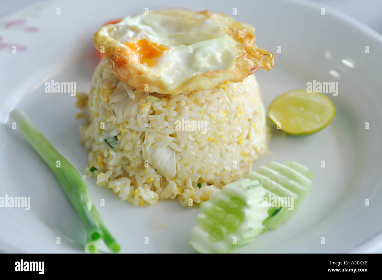 fried rice or stir-fried rice with fried egg and cucumber Stock Photo