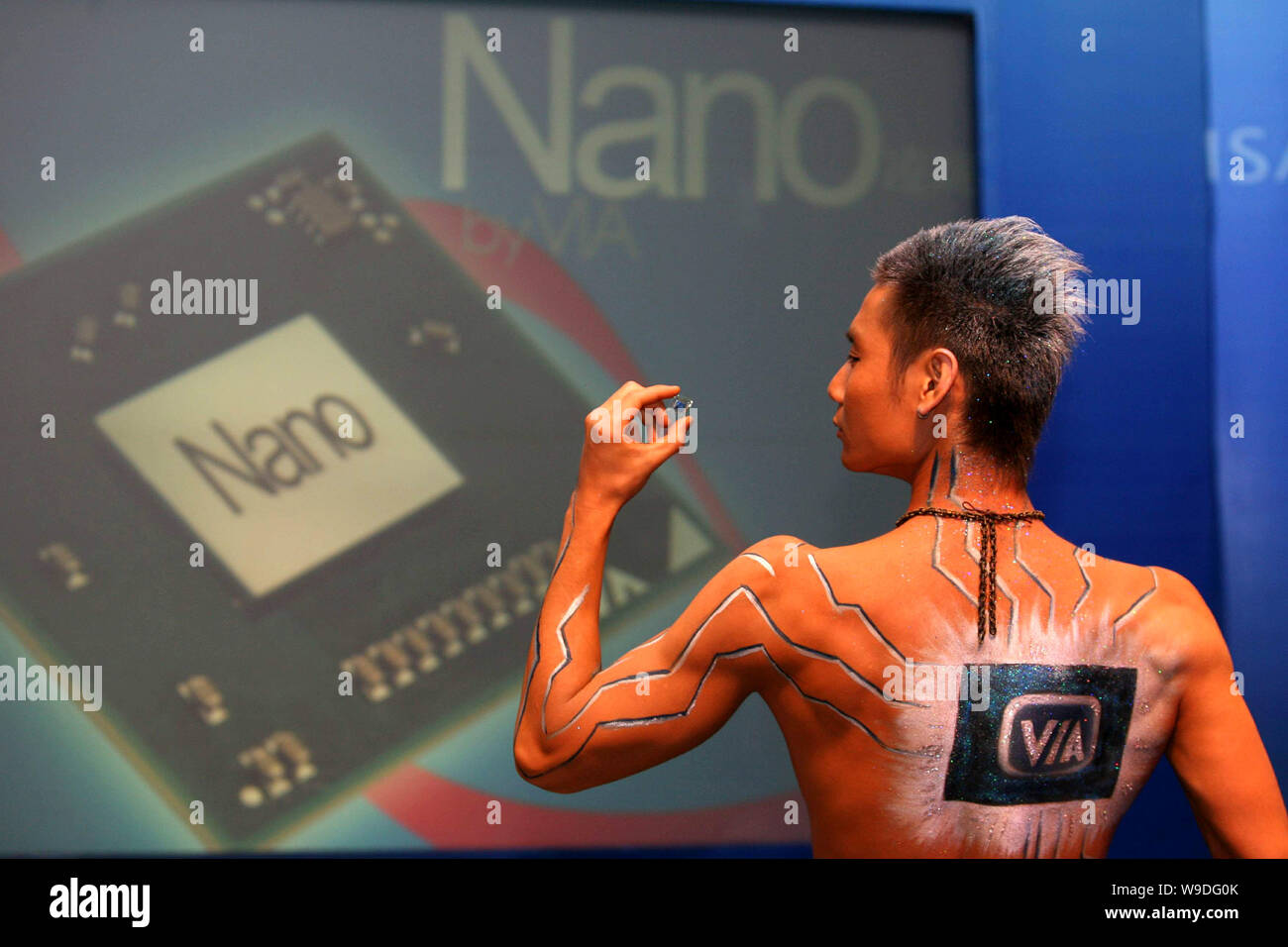 A Chinese model displays 64bit CPU NANO microprocessors made by