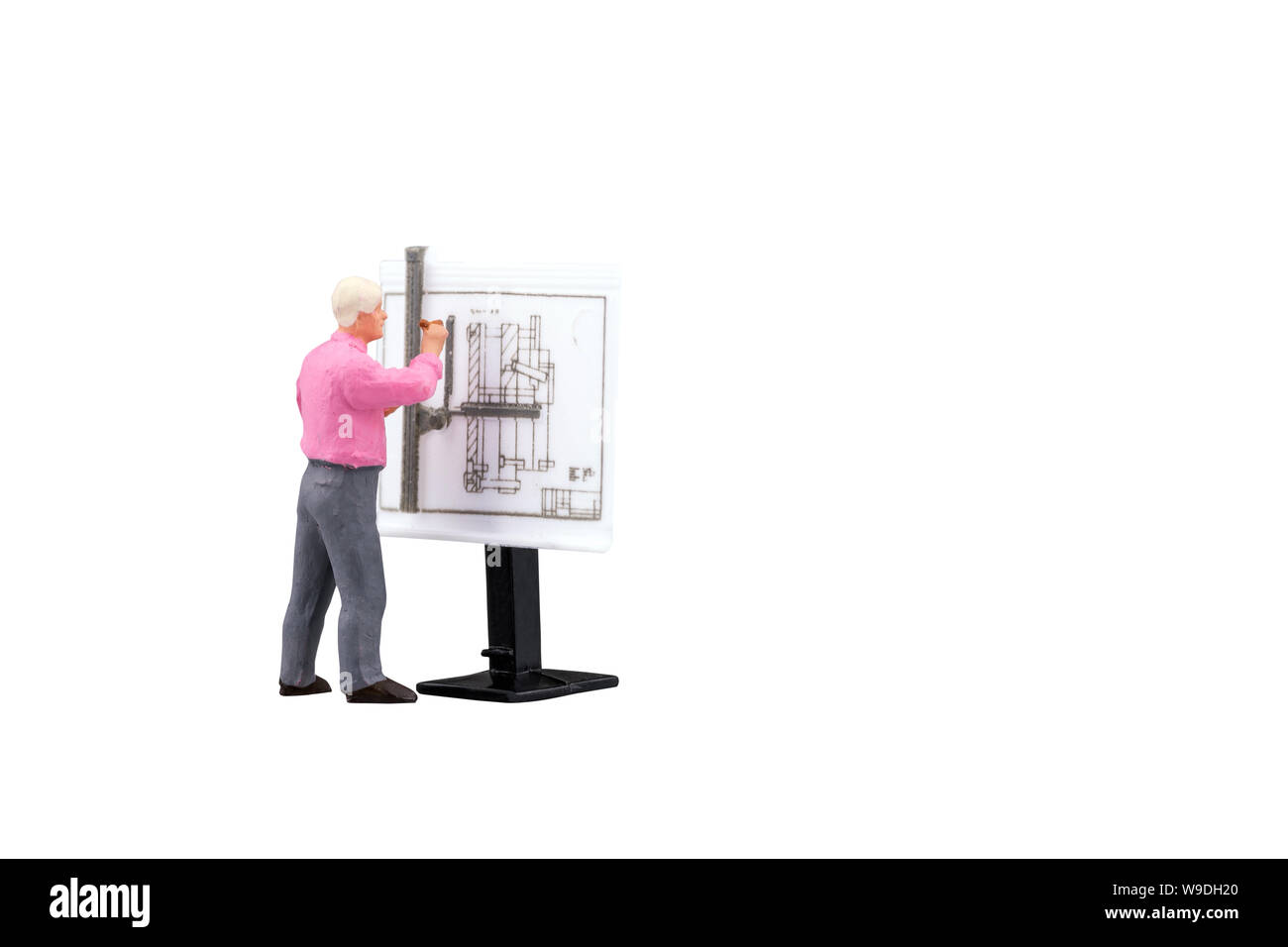 Miniature engineering people working on construction drawing isolated with clipping path on white background. Elegant Design for industrial and constr Stock Photo