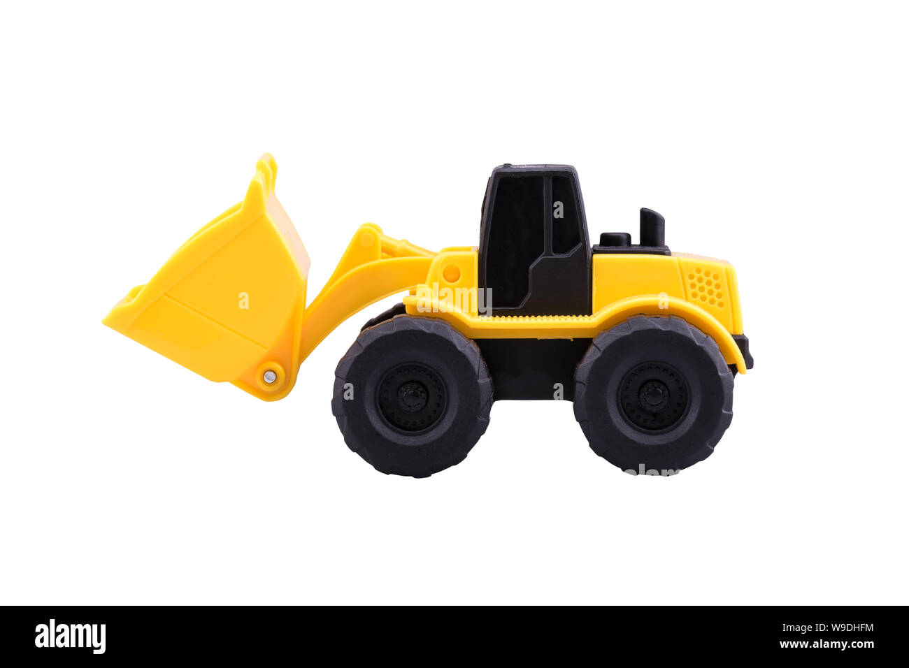 Heavy duty construction Tractor toy isolated with clipping path on white background. Stock Photo