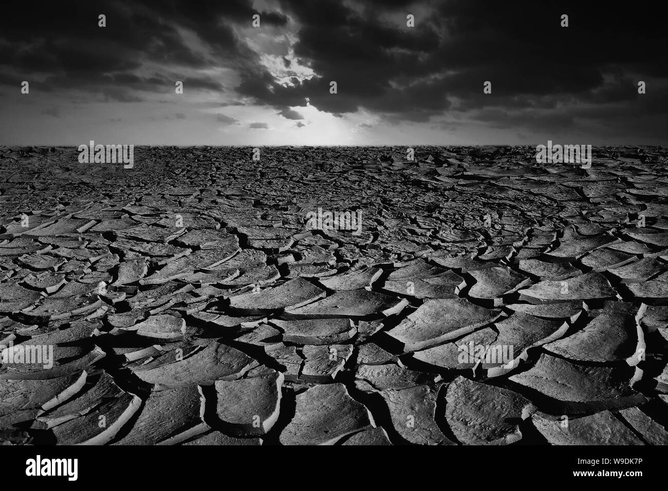 Cracked dry land without water and sky background for Global warming concept Stock Photo