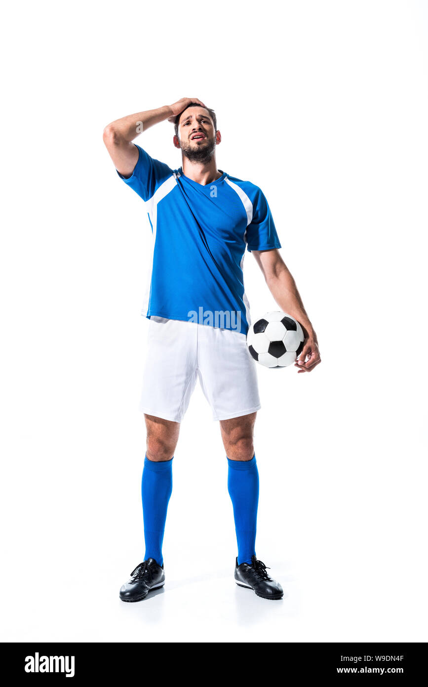 disappointed soccer player with ball and hand on head Isolated On White Stock Photo