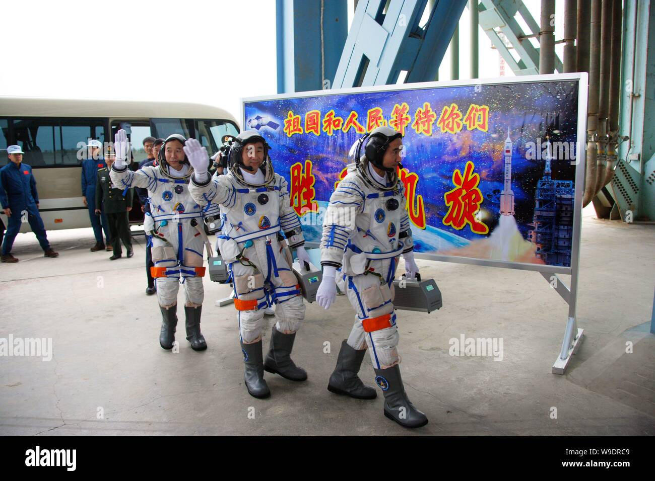 (From L) Chinese taikonauts Jing Haipeng, Liu Boming and Zhai Zhigang, walk to the launch pad before the launch of Shenzhou VI manned spacecraft at th Stock Photo