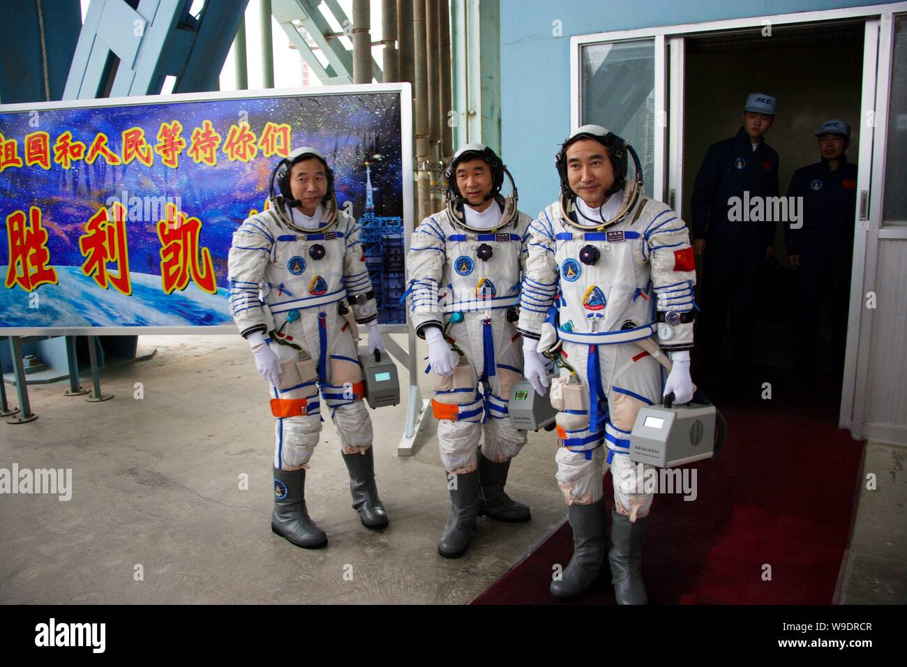 (From L) Chinese taikonauts Jing Haipeng, Liu Boming and Zhai Zhigang are ready to enter the launch pad before the launch of Shenzhou VI manned spacec Stock Photo