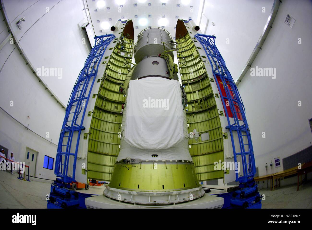 A fairing is seen being installed to cover the Shenzhou VII manned spacecraft at Jiuquan Satellite Launch Center in northwest Chinas Gansu province, 1 Stock Photo