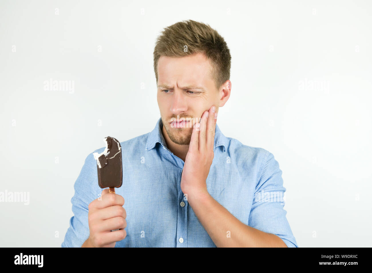 Man eats ice cream with toothache hires stock photography and images