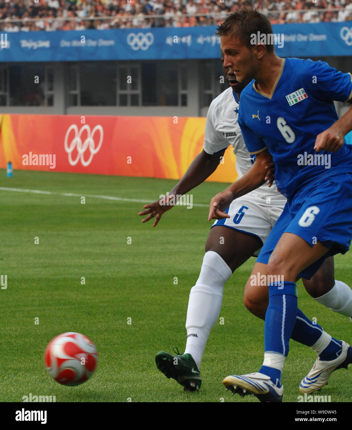 Domenico CRISCITO (R) of Italy competes with Erick NORALES of Honduras at a Group D soccer match of the Olympic Mens Soccer preliminary at the Qinhuan Stock Photo