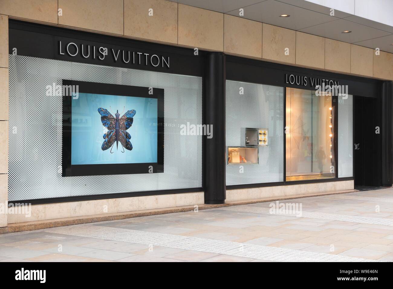 MANCHESTER, UK - APRIL 22, 2013: Louis Vuitton Luxury Fashion Store In  Manchester, UK. Forbes Says That LV Was The Most Powerful Luxury Brand In  The World In 2008 With $19.4bn USD