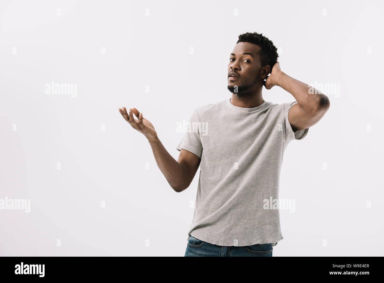 Confused curly bearded young hi-res stock photography and images - Alamy