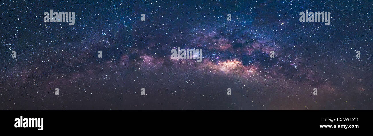 Panorama view universe space shot of milky way galaxy with stars on a night sky background.The Milky Way is the galaxy that contains our Solar System. Stock Photo