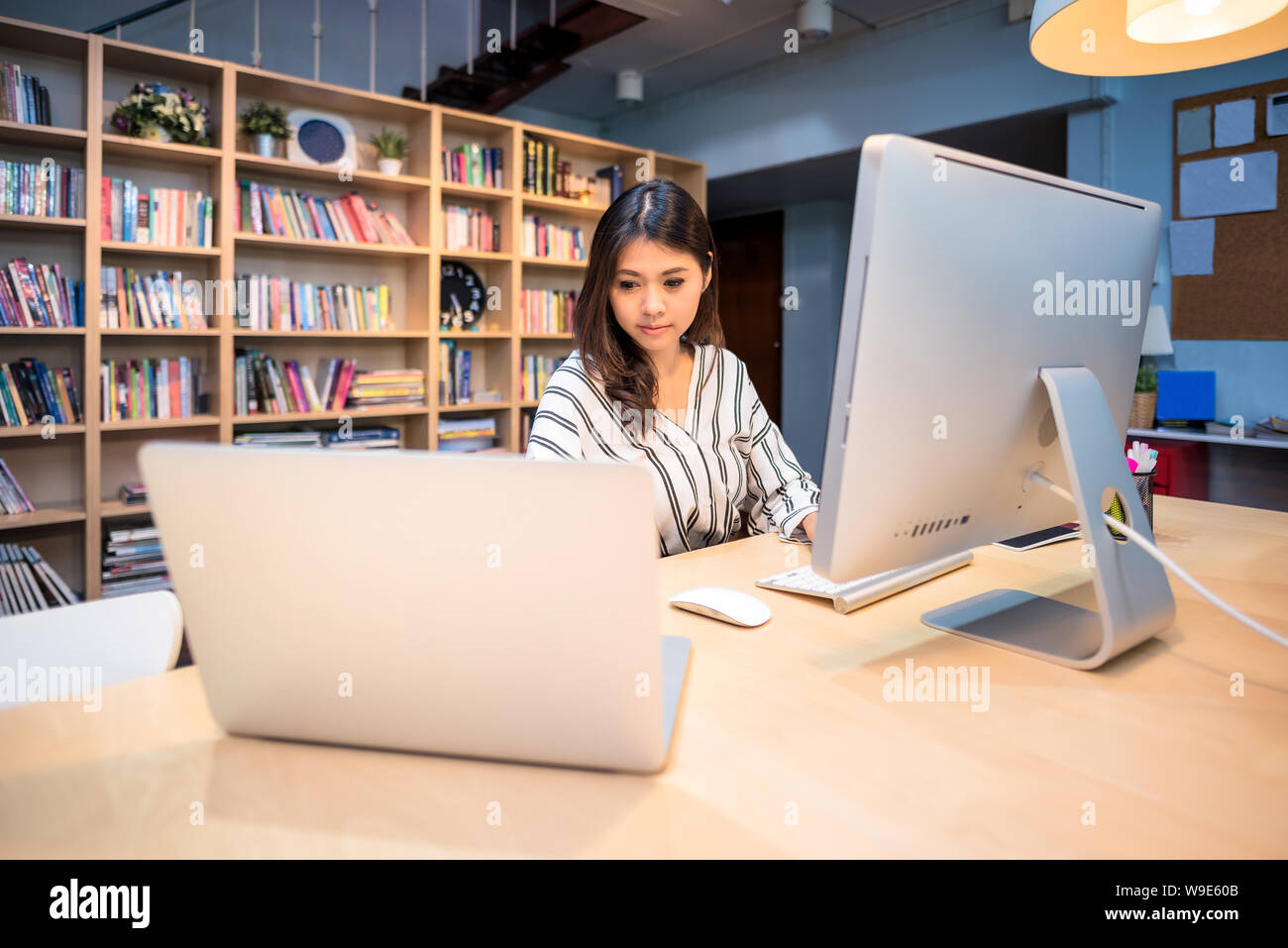 Young business entrepreneur working with big data analysis at home office. Stock Photo