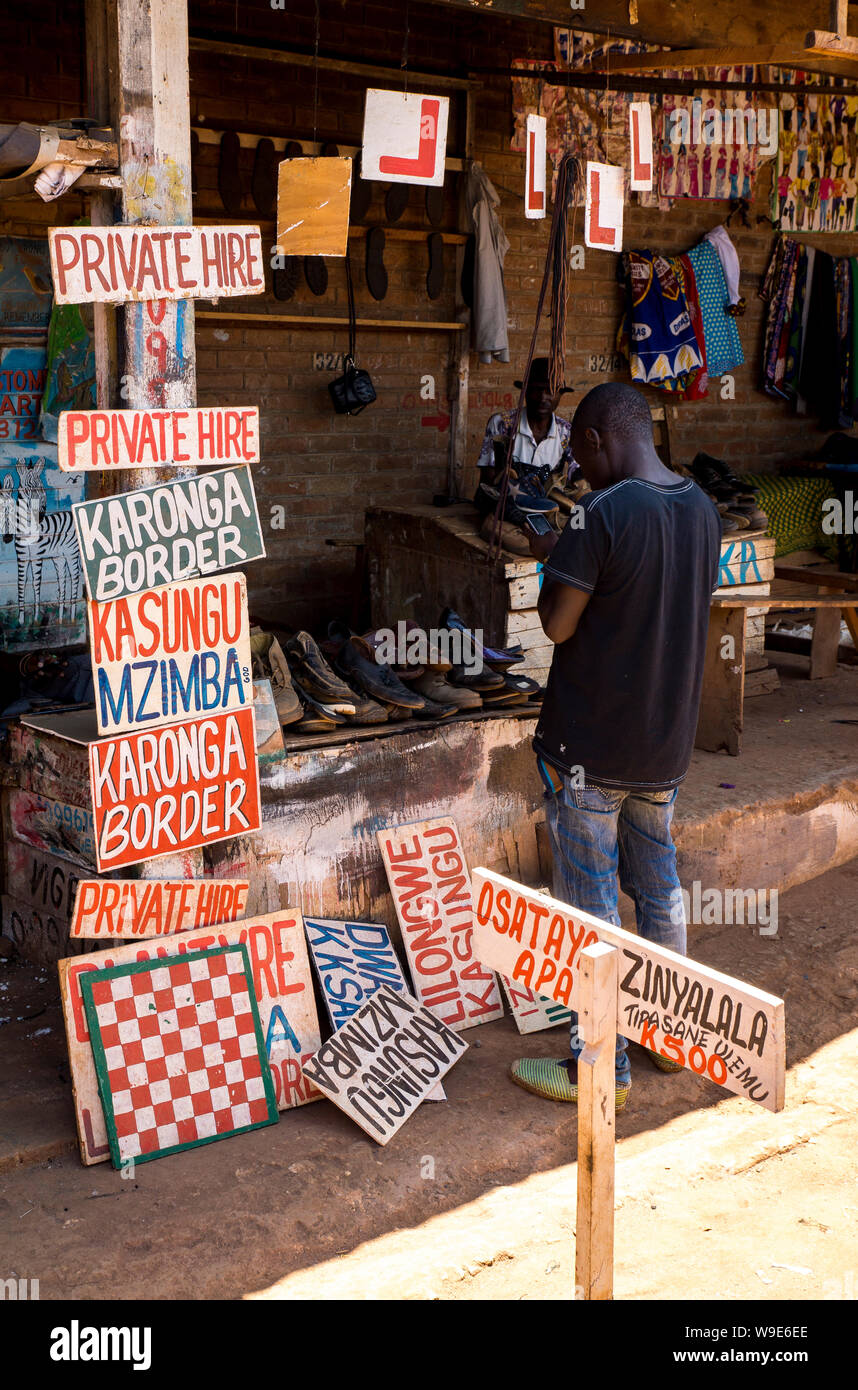 Market stall in Mzuzu market, Malawi, selling homemade artisan road signs Stock Photo